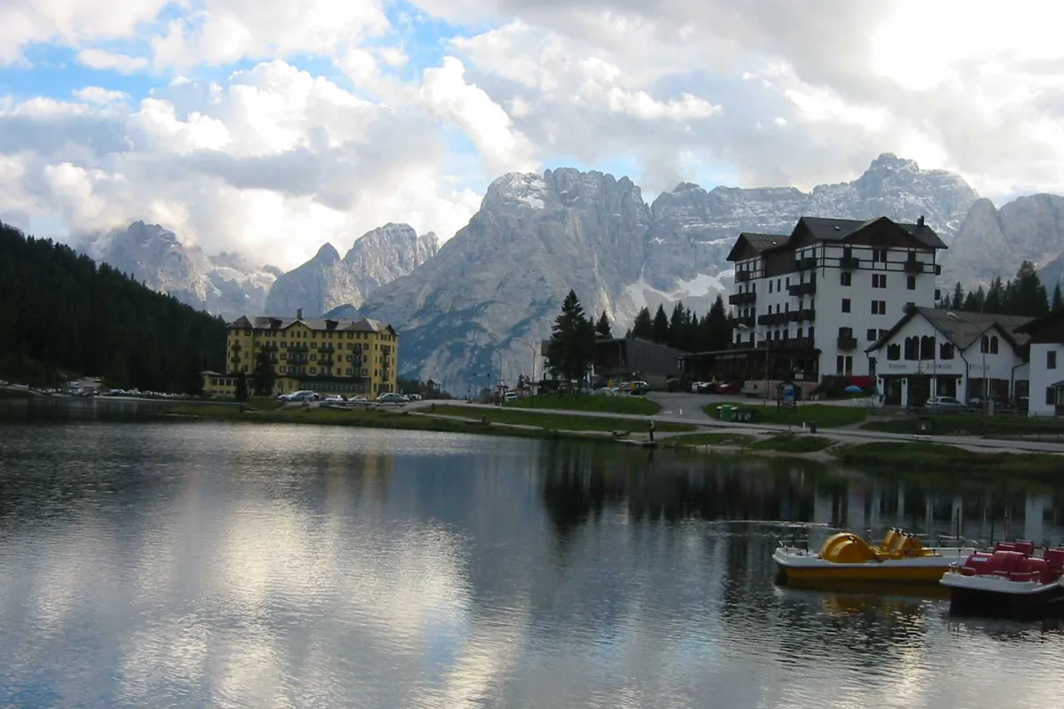 Lake Misurina reflecting the Dolomite peaks under a clear sky